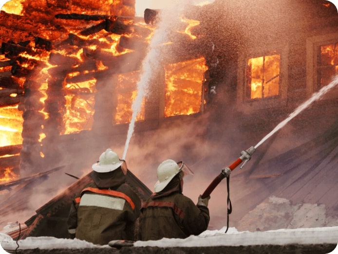 2 firemen extinguishing a storey building fire